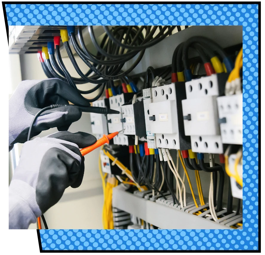 Gloved hands skillfully handle electrical testing probes on a circuit breaker panel, with colorful wires neatly organized. The mood is focused and professional.