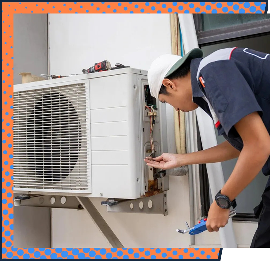 Technician performing a seasonal maintenance check on a home air conditioning system.